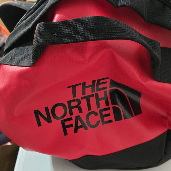 The North Face Black and Red Duffel Bag